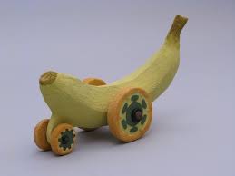 Ceramic Toy Banana With Four Green Wheels Toys Ceramics Banana
