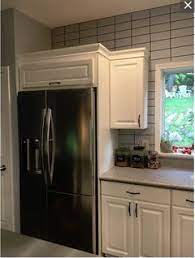 Looks terrific the way it is. Should Tile Go Above Kitchen Cabinets That Dont Go To Ceiling