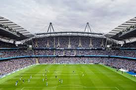 The city of manchester stadium (often abbreviated as coms) in manchester, england, also known as the etihad stadium for sponsorship reasons, is the home of manchester city f.c., with a domestic football capacity of 55,017. Manchester City Fc Legends Stadium And Club Tour Including Lunch 2021