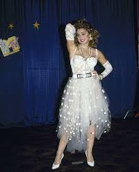 Madonna At The First Mtv Video Music Awards Vmas 1984 Where She Debuted And Preformed Her Then New Song Iconic Dresses Madonna Fashion Madonna 80s Fashion