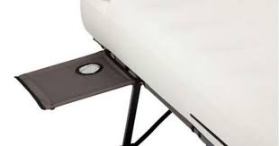 There Are Two Side Tables In The Coleman Queen Cot System