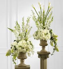 They are then brought to the cemetery after the funeral mass, and placed by the. Markham Florist The Classic White Arrangement Large Flower Arrangements Large Floral Arrangements Flower Arrangements