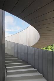Intertwining Staircases Spiral Around The Glazed Core Of Hiroshi Nakamura S Ribbon Chapel Architecture Architecture Photography Japanese Architecture