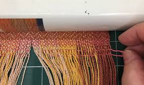 Now open up the loop (both pieces of yarn) and slip the ends of the yarn (all 4 ends) through the loop. How To Finish A Handwoven Scarf With A Twisted Fringe Craftsy