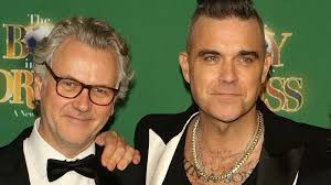 The Complex Relationship Between Robbie Williams And Guy Chambers, Explained