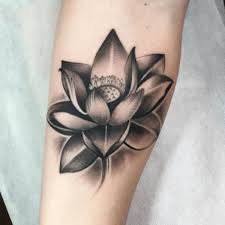 This alone makes them the perfect choice for a tattoo in just about any location on your body. Black Ink Lotus Flower Tattoo Design For Sleeve