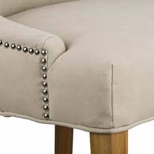 Covered in a lovely display of neutral fabric. Cream High Wing Back Dining Chair Dining Chair Dining Decor