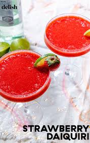 Strawberry Daiquiris Have Us Day Dreaming Of Summer Recipe In 2020 Strawberry Daiquiri Frozen Strawberry Daiquiri Recipe Frozen Drinks