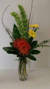 Bells Of Ireland Gerbera Daisies And Pincushion Protea Flower Arrangements Flower Centerpieces Ikebana Arrangements
