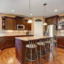 9102019 the light gray walls a popular kitchen paint color for dark cabinets provide subtle contrast and keep the room feeling bright and airy. The Best Color To Paint Your Kitchen If You Have Dark Cabinets