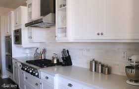 Quartz is an engineered stone. Caesarstone London Grey Quartz Countertops In A White And Gray Kitchen Stainless Caniste Gray And White Kitchen Caesarstone Kitchen Blue Gray Kitchen Cabinets