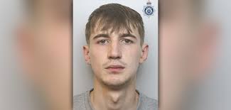 Laughing robber who threatened to stab victim jailed