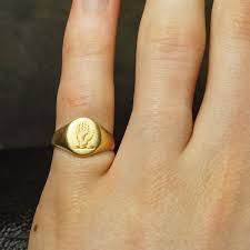 This gold anchor pinky signet ring provides a very wealthy look. 1950s Halt In The Name Of The King Signet Ring Butter Lane Antiques