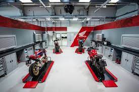 Planning And Production Of Motorcycle Workshop Equipments Paddock Stands Motorcycle And Auto Motorcycle Workshop Motorcycle Brands Motorcycle Showroom Design