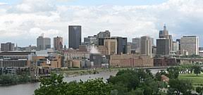 The twin cities in minnesota are a great example, they were founded in close proximity and you can take it from me that there isn't much of a definite border between the two. Minneapolis Saint Paul Wikipedia