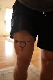 Tattoo on r_arm (tat r arm/native seal); My Take On The Muted Post Horn Tattoo Thomaspynchon