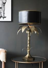 Milo floor lamp, gold $165.00. 10 Statement Palm Tree Lights