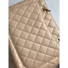 The front of the bag has raised double c's stitched onto the quilted leather and the back of the bag has a large slip pocket. Chanel Chanel Gst Grand Shopping Tote Handbags Leather Beige Ref 69959 Joli Closet