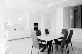Black and white dining room pictures. Luxurious Modern Dining Room With White Table Black Chairs And Stock Photo Picture And Royalty Free Image Image 147457992