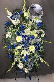 His wooden casket quickly became adorned with bouquets of flowers. Dallas Cowboys Standing Easel Spray In Dallas Tx I Love Roses Florist