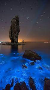 Man standing in between neon lights. Amoled Nature Wallpaper 77 Amoled Wallpapers Black Backgrounds Dark Wallpapers For Android And Iphone Dark Wallpaper Nature Photography Blue Sea