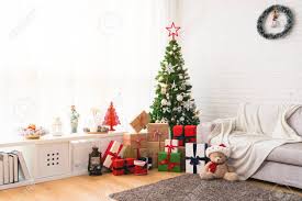 Maybe you would like to learn more about one of these? Perfect Christmas Tree With Gifts Underneath In Bright Living Room For Background Stock Photo Picture And Royalty Free Image Image 90261702