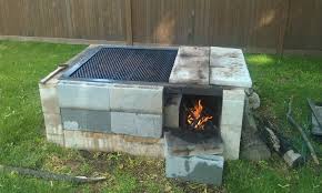 Fence Made Of Cinder Blocks And Posts Less Than 250 To Build And Believe Me U Learn To Cook On This And Cinder Block Fire Pit Fire Pit Grill Diy Backyard