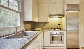 A simple white and wood small kitchen design achieves individuality with drill hole patterned boards. Simple Kitchen Design For Very Small House Kitchen Kitchen Designs Simple Kitchen Design Small Kitchen Design