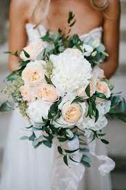 Deciding on your wedding bouquet flowers is super exciting. The Most Popular Wedding Bouquet Flower Is Wedding Flower Guide Flower Bouquet Wedding Neutral Wedding