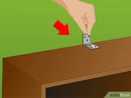 Move across the wall using shims and 1 ¼ screws to secure cabinet boxes together and to wall with cabinet screws. How To Secure A Bookcase To A Wall 15 Steps With Pictures