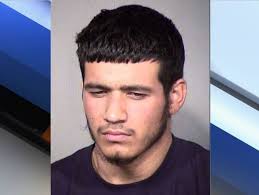 Police say this man -- armed with a sawed-off shotgun -- stole a vehicle  from two men sitting