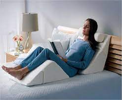 relax in bed with a bed wedge ergoprise blog bed wedge pillow relaxing bedding bed wedge