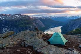 A hiking trip is the best way to see beautiful landscapes and explore vast wilderness areas. Alone Tent On Trolltunga Rock Stock Photo Picture And Royalty Free Image Image 86563654