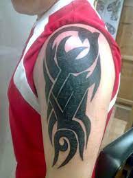 A dark wolf tattoo idea to cover some tattoos. Tribal Tattoo Cover Up Ideas Photo Large Tattoo Cover Up Ideas Gallery Tribal Tattoos Cover Up Tattoos Tribal Tattoo Cover Up