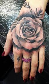 Rose Tattoos Are Always In Bloom Tatouage Rose Sur Main Tatouage Rose Tatouage
