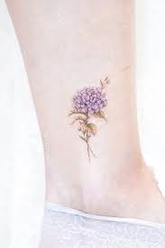 23 Flower Tattoos Designs And Meanings For Your Inspo Meaningful Flower Tattoos Small Watercolor Tattoo Hydrangea Tattoo