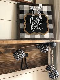 Bet33286449 on may 12, 2018 i have a white garage door that i would like to paint or stain so that it looks like real wood. Easy Diy Buffalo Check Sign No Painting Required Wilshire Collections