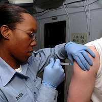 Lt. Amy Moore, a Navy reserve nurse at Naval Hospital Jacksonville's  Multi-Service Unit, readies an IV for use.