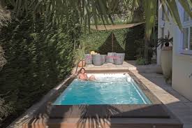 #3 create a small basin in the middle of a garden beneath a water fountain. Rectangle Pool Landscaping Ideas