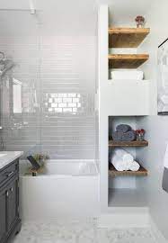 White bathroom vanities are a better option for small bathrooms than dark wood vanities because the white helps to brighten up the room. 6 White Bathroom Ideas For A Peaceful Vibe Houseminds Small White Bathrooms Small Bathroom With Tub White Bathroom Tiles