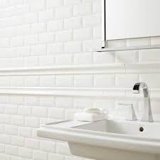 Mirror framed in tile chair rail and tile pencil liner. Ceramic Tile Chair Rail Google Search White Beveled Subway Tile Beveled Subway Tile White Subway Tile Bathroom