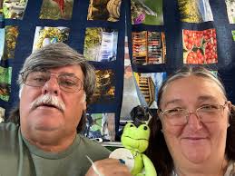 I bought these Sun Bonnet Sue squares at a yard sale this summer. And  squared up the blocks and put them together. This is a queen bed. (I know  it looks distorted.)