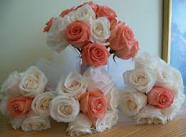 For the bride's bouquet maybe a few little blue flowers or just a little bigger. Our Beautiful Wedding Bouquets Coral Salmon Roses With White Roses Coral Bouquet Wedding Wedding Bouqet Wedding Bouquets
