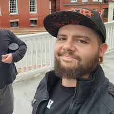 Tony's Pushcart” (let's call him “Tony”) was moved here from an antiques  dealer in New Hampshire in 1996 and was “originally painted blue and white  with vertical stripes.” The motorcycle repair business