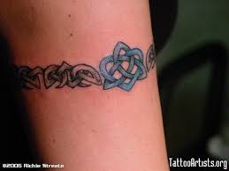 Celtic heart tattoos symbolize the union of two souls, and is usually used to show devotion to your loved ones. Nice Celtic Band With Celtic Knot Wrist Band Tattoo Cuff Tattoo Band Tattoo Designs