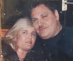 Could anyone help with this photo of my late dad please ? It's stuck to the  glass of a broken frame ☹️ He had blue/grey eyes and brown hair if anyone  wanted