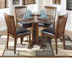 Ashley Stuman Medium Brown 5 Pc Round Drop Leaf Dining Set On Sale At Wcc Furniture Mattress Serving Lafayette La And Acadiana Mesas Comedores