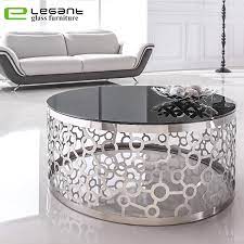 Doubling as an art piece and a practical place to set down the remote, this sleek coffee table brings a splash of contemporary style as it adds functionality to your living room. China Artistic Metal Base Black Glass Coffee Table China Coffee Table Glass Coffee Table