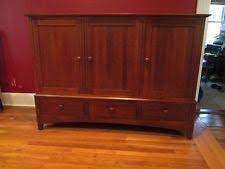 The center drawer contains a built in silverware holder. Ethan Allen American Impressions Entertainment Center Entertainment Center Cherry Entertainment Center Home Decor