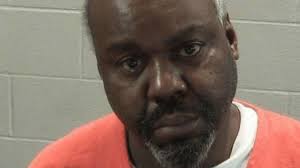 Husband of woman found dead charged in Omro double homicide